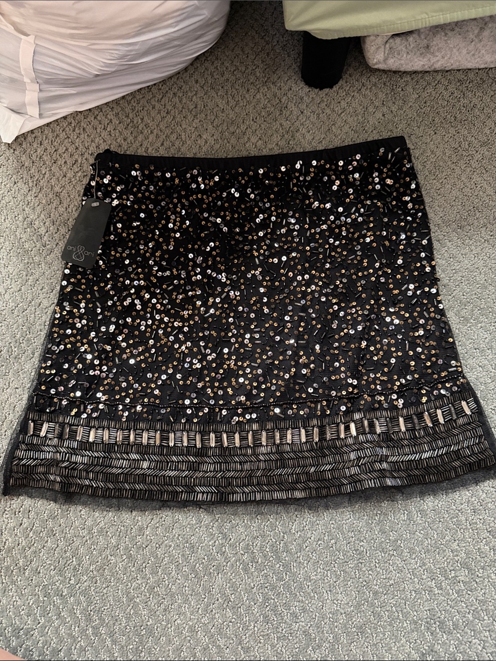 Black Sequin-Embellished Mini Skirt with Decorative Hem